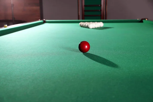 Different balls on modern billiard table indoors — Stock Photo, Image