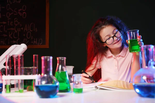 Child doing chemical research in laboratory, space for text. Dangerous experiment — Stockfoto