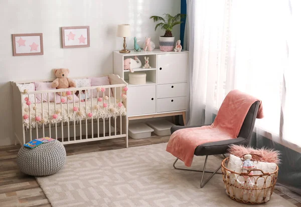 Cozy baby room interior with comfortable crib — Stock Photo, Image