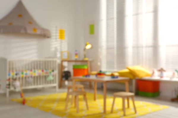 Dimsyn på mysiga baby room interiör — Stockfoto