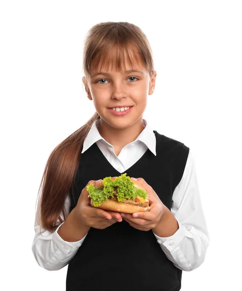 Menina feliz segurando hambúrguer no fundo branco. Comida saudável para o almoço escolar — Fotografia de Stock