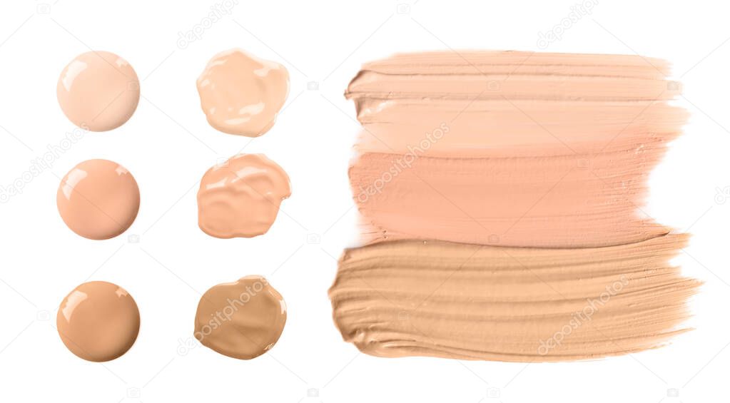 Set of different foundation shades on white background, top view 