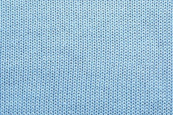 Light blue winter sweater as background, closeup view Stock Photo