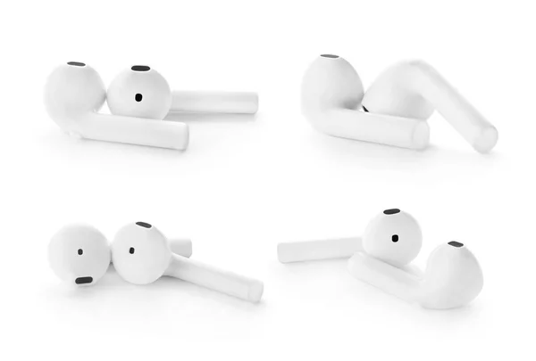 Set of modern wireless earphones on white background — Stock Photo, Image