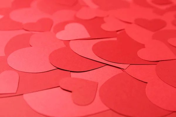 Όμορφη κόκκινο χαρτί καρδιές ως φόντο, closeup — Φωτογραφία Αρχείου