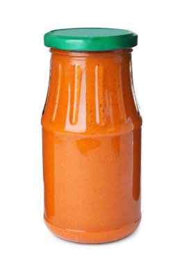 Kabak turşulu cam kavanoz beyaza saçılmış.