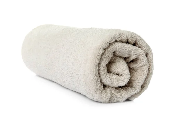 Rolled clean beige towel on white background — Stock Photo, Image