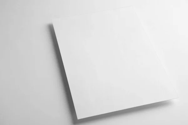 Blank paper sheet on white background. Mock up for design — 图库照片