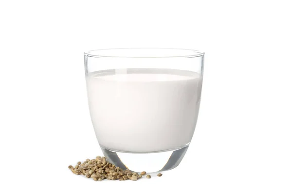 Copo de leite de cânhamo e sementes em fundo branco — Fotografia de Stock