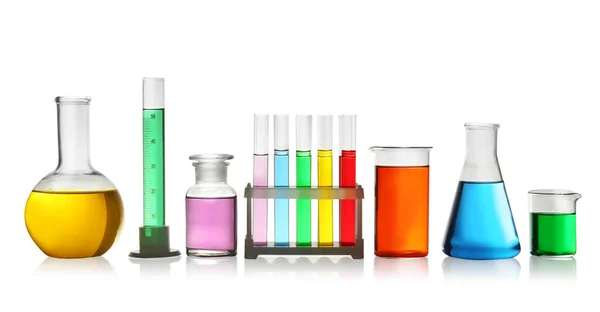 Laboratory glassware with colorful liquids on white background Stock Image