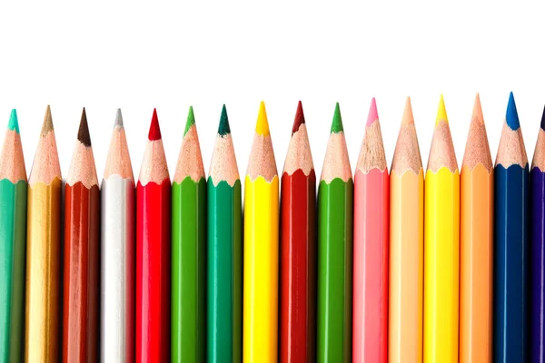 Lápices de diferentes colores sobre fondo blanco, vista superior. Papelería escolar — Foto de Stock