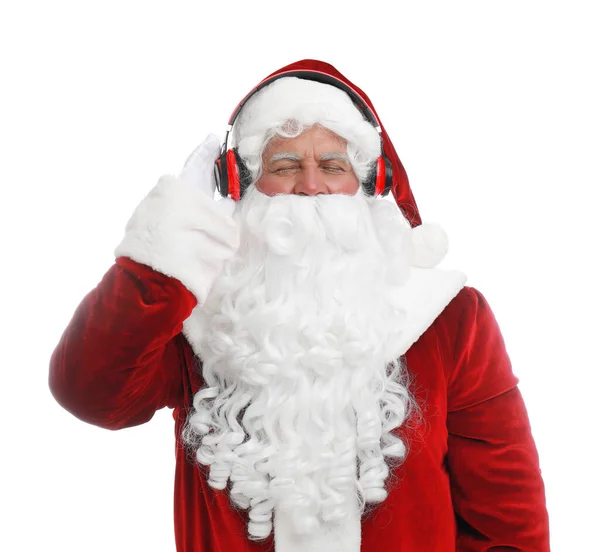 Santa Claus luisteren naar de muziek van Kerstmis op witte achtergrond — Stockfoto