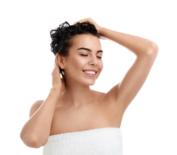 Beautiful young woman washing hair on white background — Stock Photo, Image