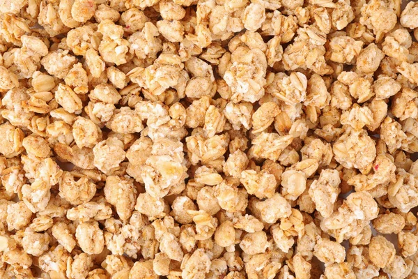 Healthy crunchy granola as background, top view — ストック写真