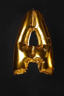 Altın harf Siyah zemin üzerinde bir balon