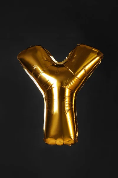 Golden letter Y balloon on black background — Stock Photo, Image