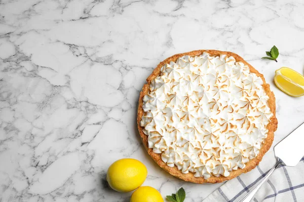 Flat lay composition with delicious lemon meringue pie on white marble table, space for text — Stock Photo, Image