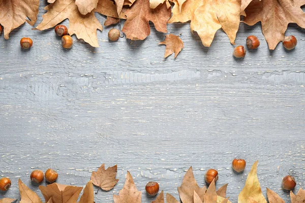 Frame made of autumn leaves on grey background. Space for text — Stockfoto