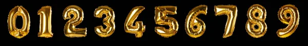 Set with golden foil balloons in shape of numbers on black background — ストック写真