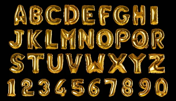 Set with golden foil balloons in shape of letters and numbers on black background — Stock Photo, Image