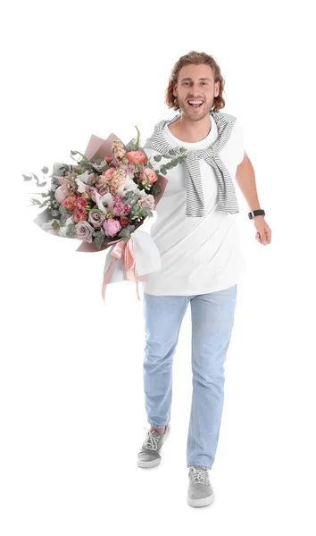 Jovem homem bonito com lindo buquê de flores no fundo branco — Fotografia de Stock