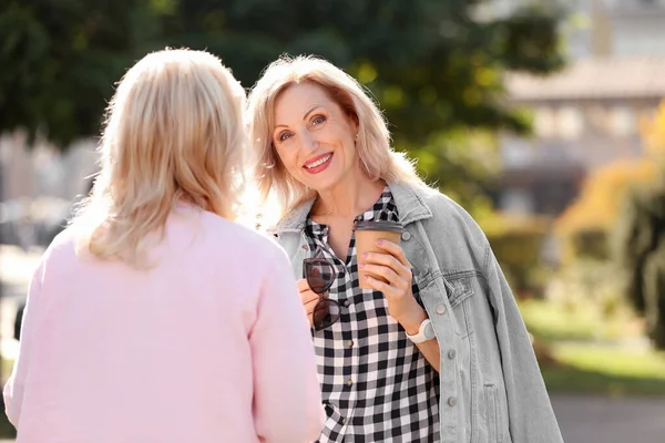 Happy mature women in park on sunny day — Stock Photo, Image