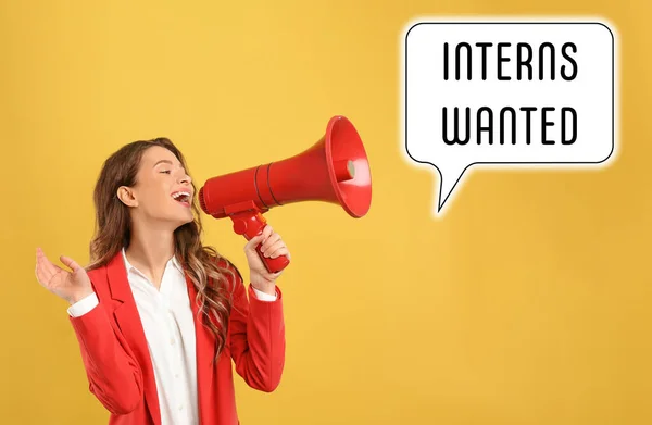 Young woman with megaphone and text INTERNS WANTED on yellow background