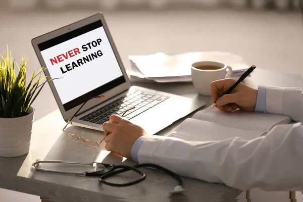 Doctor Working Laptop Table Office Closeup Never Stop Learning — Stock Photo, Image