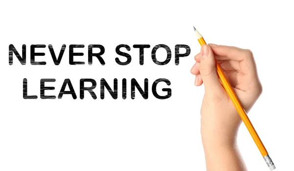 Woman Writing Phrase Never Stop Learning White Background Closeup Banner — Stock Photo, Image