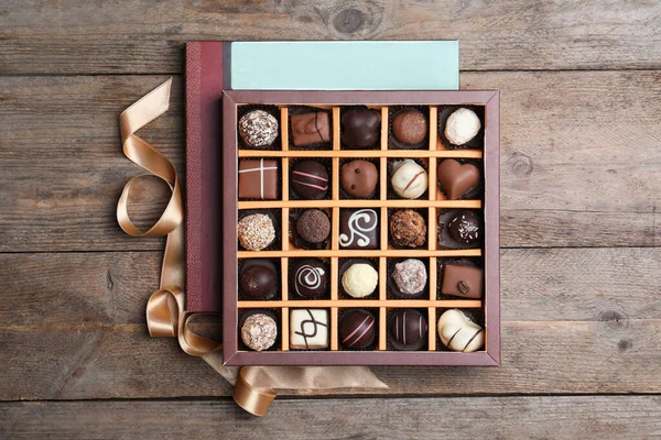 Box Tasty Chocolate Candies Wooden Table Flat Lay — Stock Photo, Image