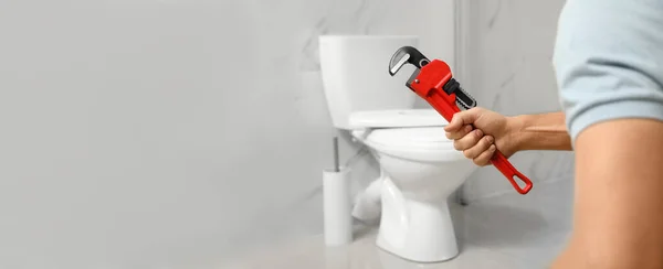 Closeup View Professional Plumber Holding Pipe Wrench Toilet Bowl Bathroom — Stock Photo, Image