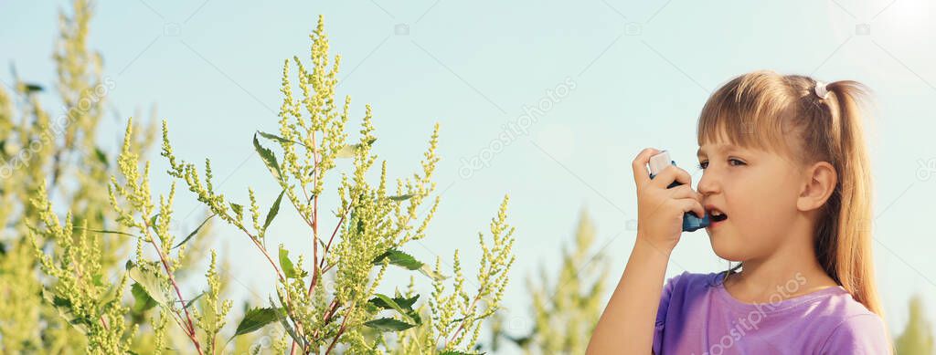 Little girl with inhaler suffering from ragweed allergy outdoors, space for text. Banner design