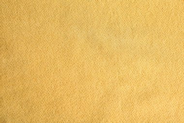 Arka plan olarak güzel sarı kumaşın dokusu, yakın plan