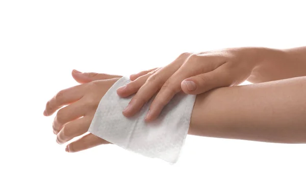 Woman cleaning wrist with wet wipe on white background, closeup