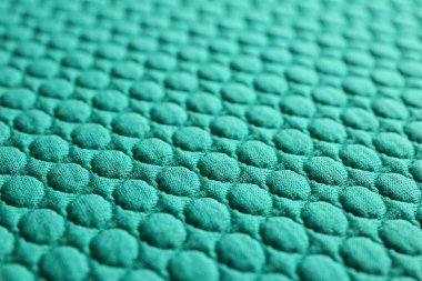 Arkaplan olarak desenli turkuaz kumaş, yakın görünüm