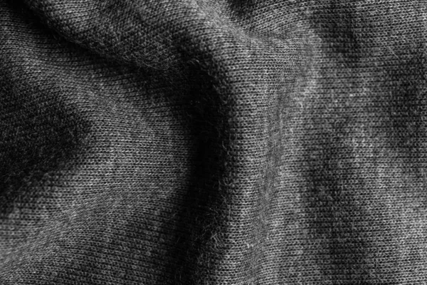 Arka plan olarak yumuşak gri kumaşın dokusu, yakın plan