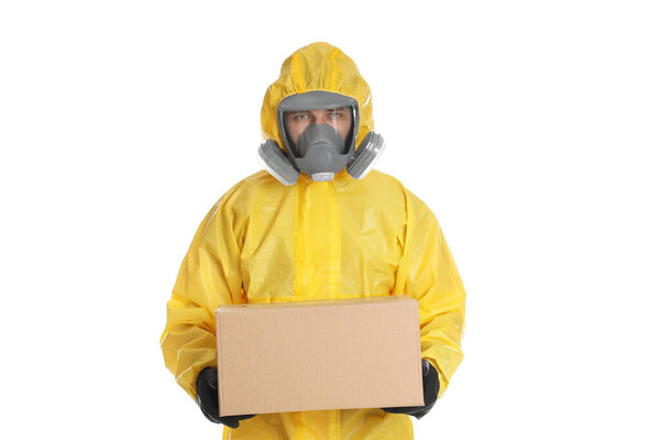 Man wearing chemical protective suit with cardboard box on white background. Prevention of virus spread