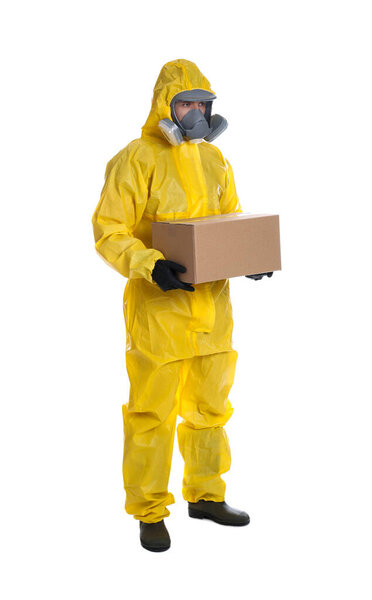 Man wearing chemical protective suit with cardboard box on white background. Prevention of virus spread