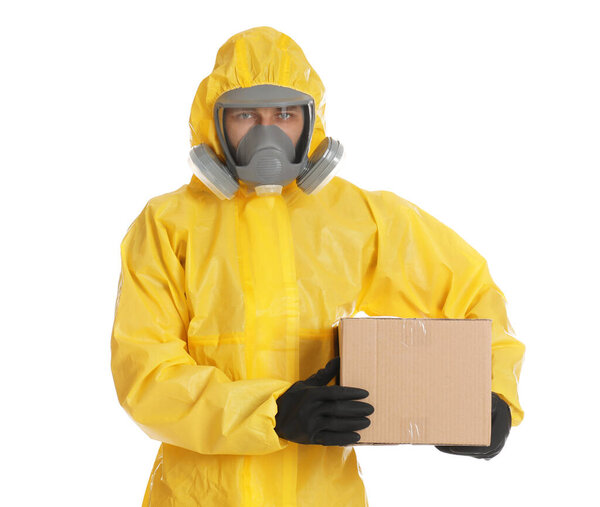 Man wearing chemical protective suit with cardboard box on white background. Prevention of virus spread