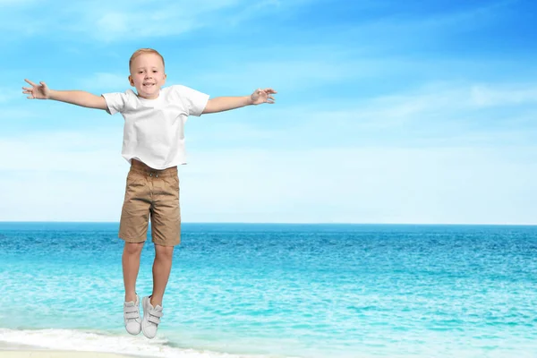 Cute School Boy Jumping Beach Sea Space Text Summer Holidays — Stock Photo, Image