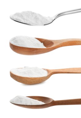 Set with spoons of baking soda on white background clipart