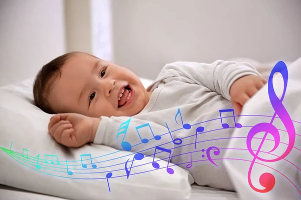 Flying music notes and cute little baby lying in comfortable crib. Lullaby songs