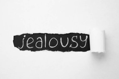 Arkaplan olarak yırtık kağıt altında Kelime JealOUSY, üst görünüm