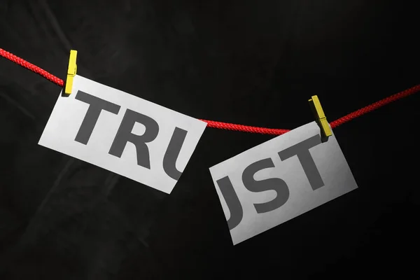 Cut Word Trust Hanging Rope Black Background Concept Jealousy — Stock Photo, Image