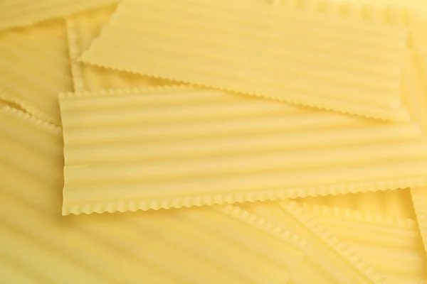 Haufen Ungekochter Lasagneblätter Als Hintergrund Nahaufnahme — Stockfoto