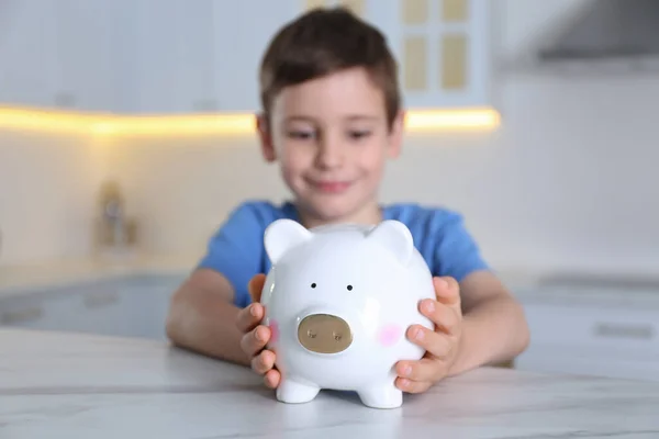 Little Boy Piggy Bank Marble Table Indoors — Stock Photo, Image
