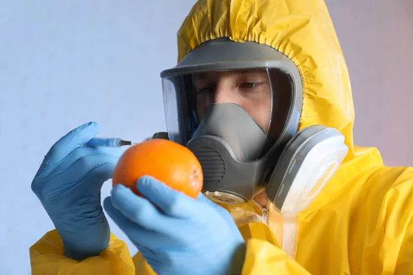 Scientist Chemical Protective Suit Injecting Orange Color Background — Stock Photo, Image