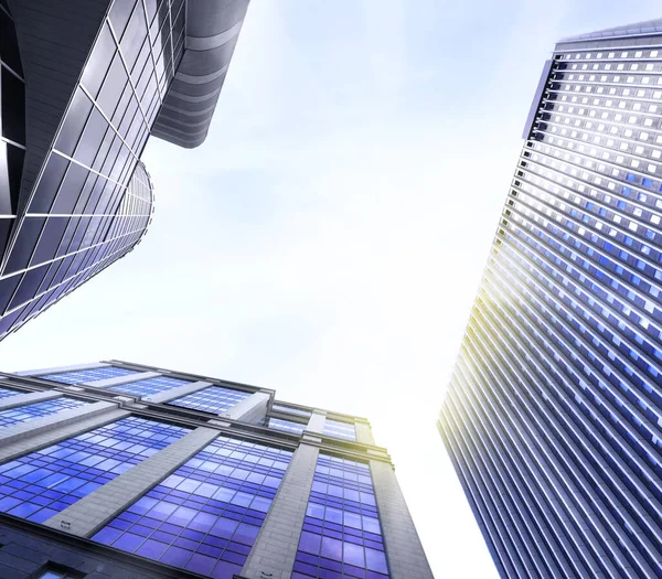 Office buildings with tinted windows, low angle view. Modern architectural corporation