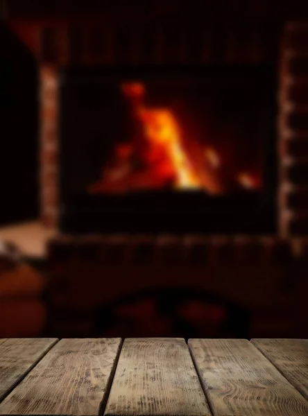 Rustic Table Fireplace Burning Wood Indoors — Stock Photo, Image