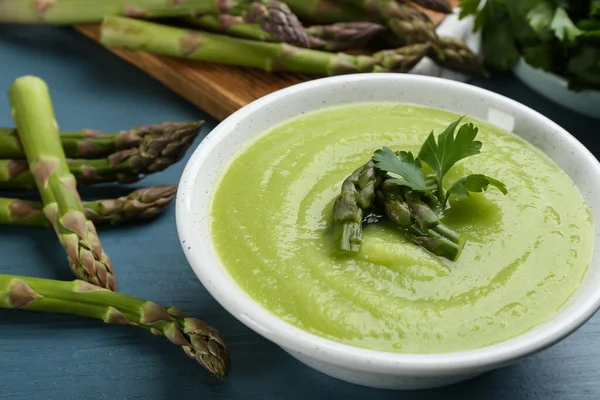 Delicious Asparagus Soup Served Blue Wooden Table Closeup — Stock Photo, Image